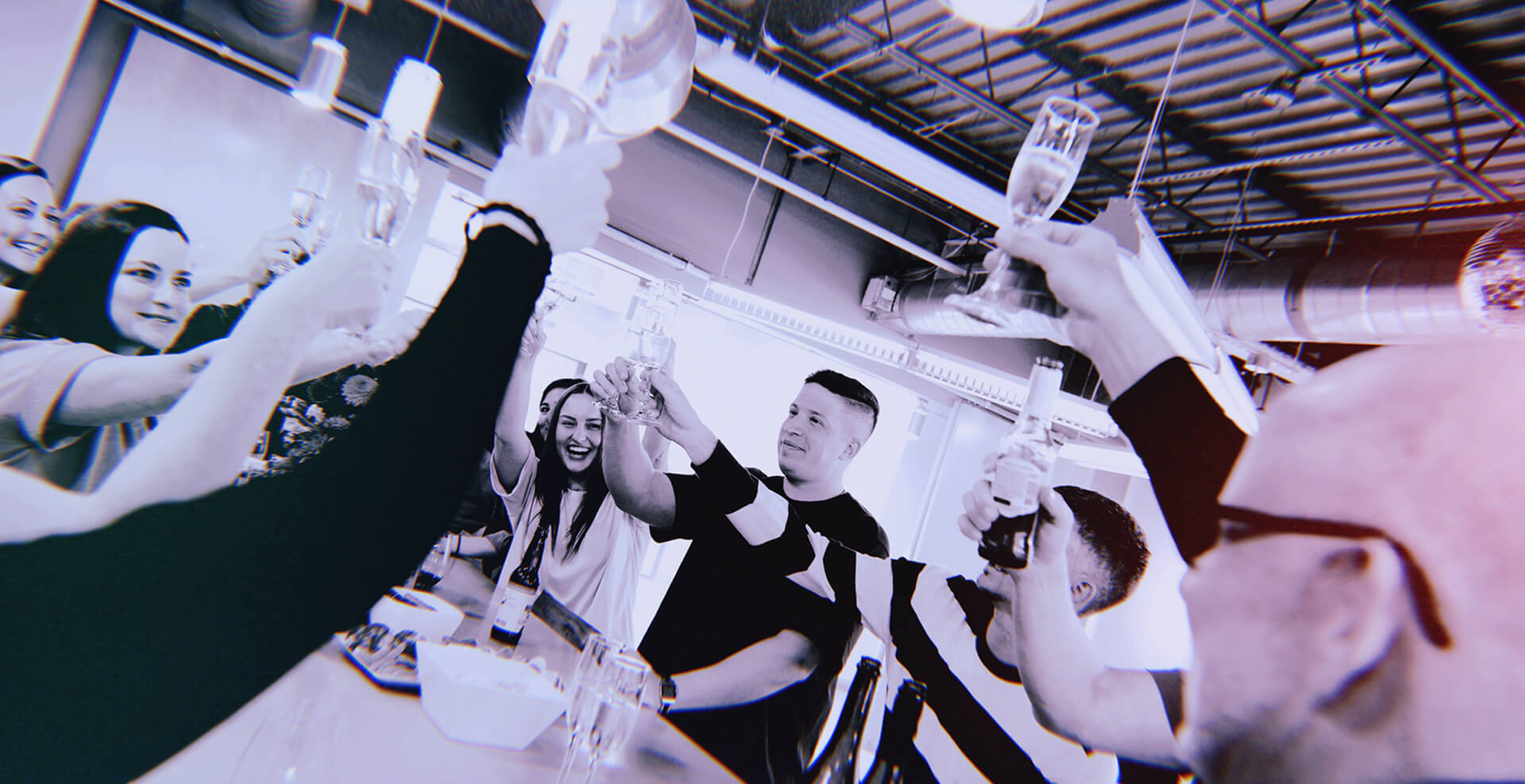 Firehouse colleagues raising glasses together in the Dallas office