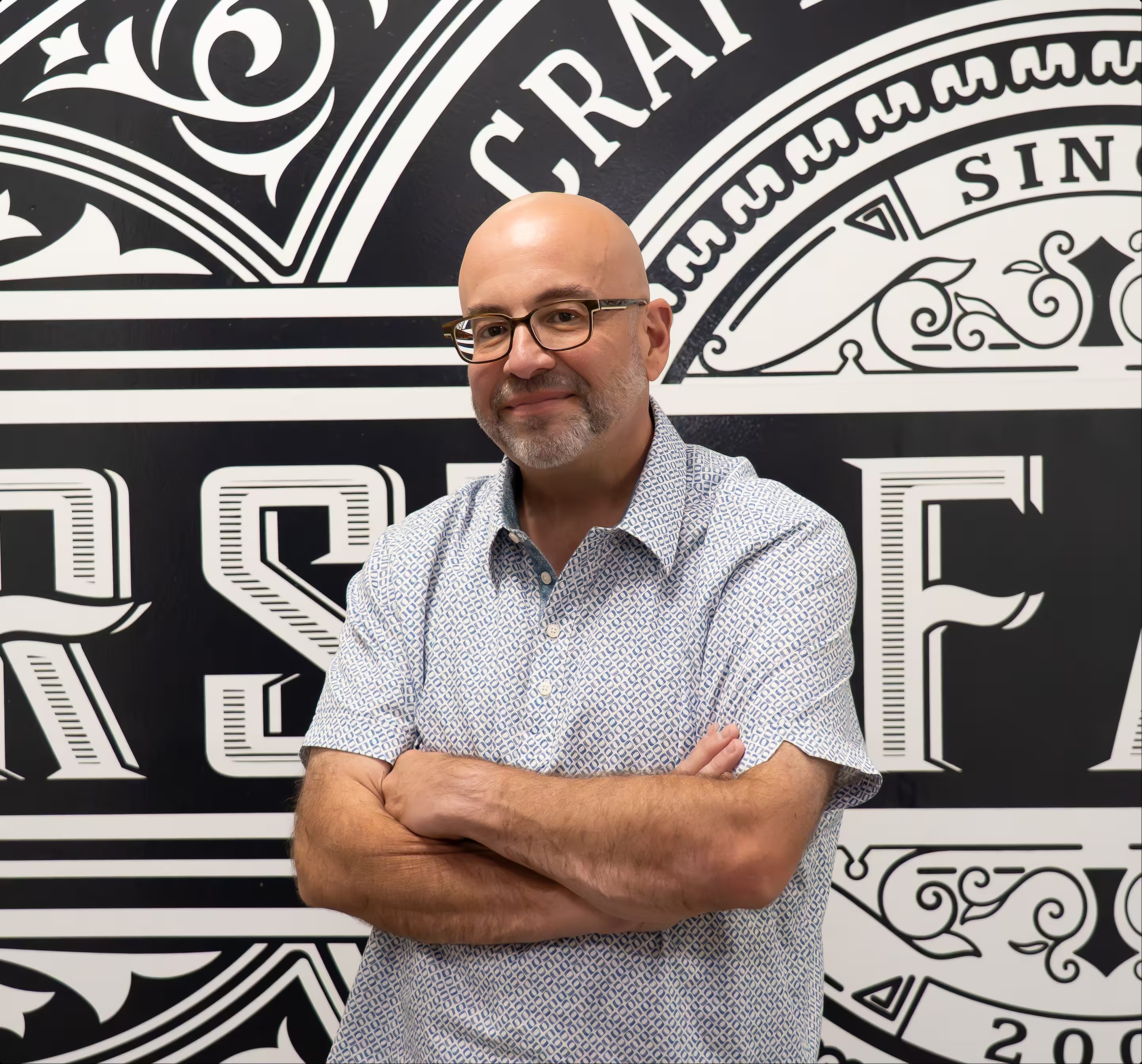 First Factory founder Jason T. Roff standing with his arms crossed
