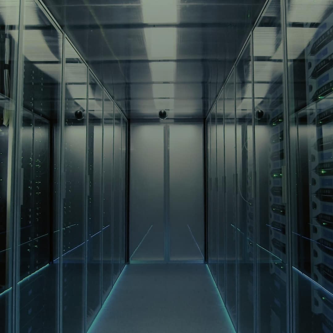 Rows of illuminated server racks in a FIS website brand photograph