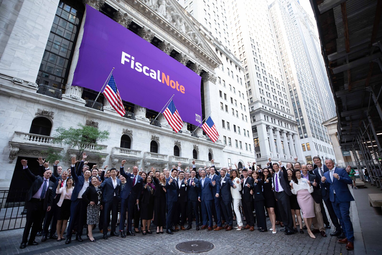 FiscalNote employees and guests gathered outside the New York Stock Exchange for its 2022 public debut