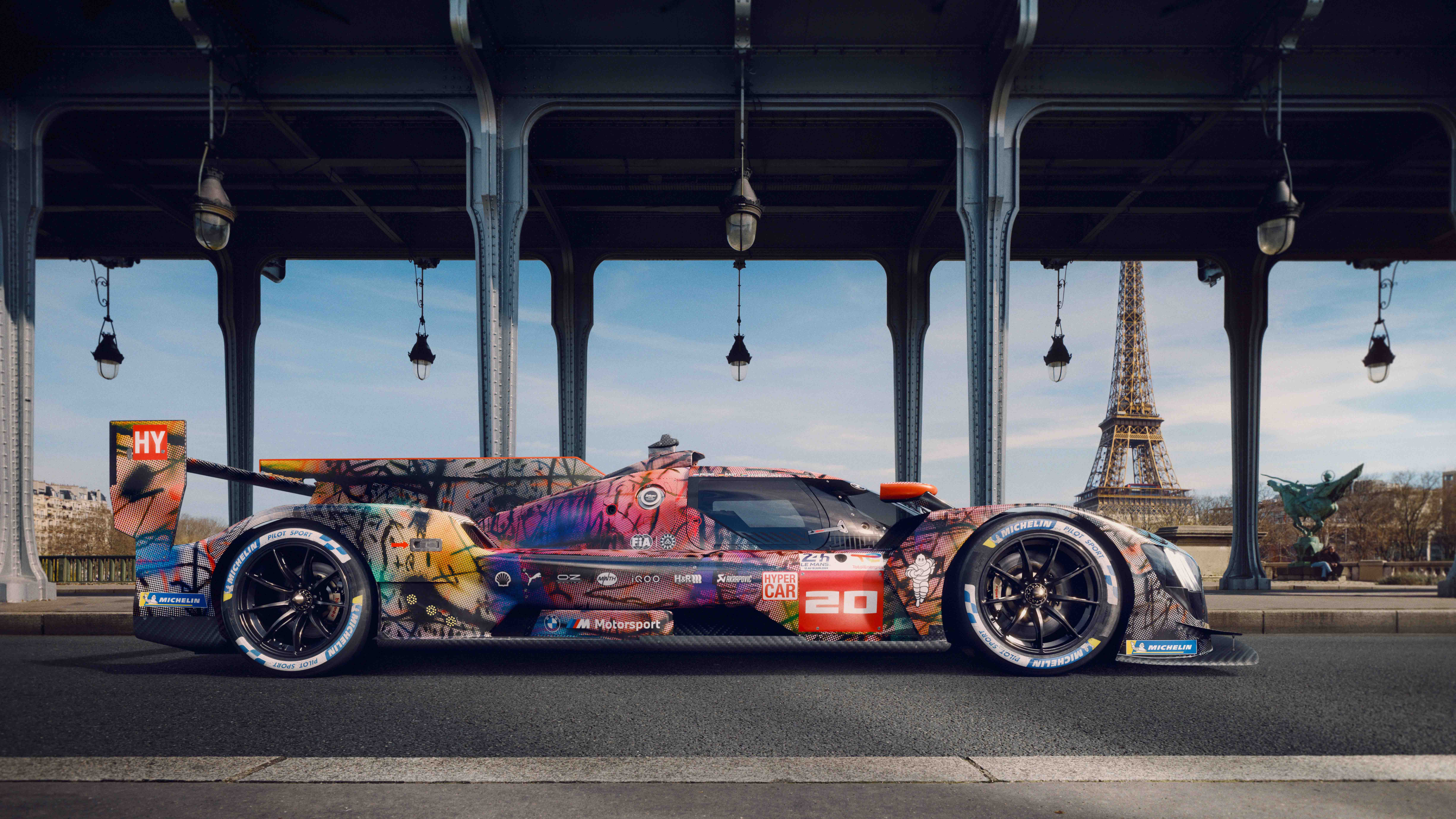 Julie Mehretu's BMW Art Car parked beneath a steel bridge in Paris