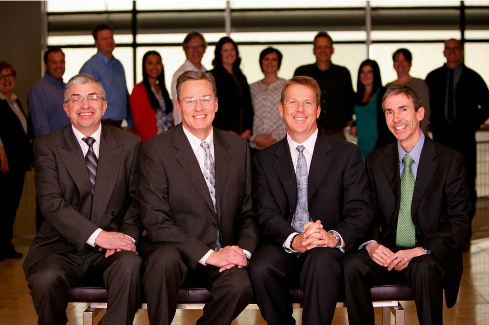 Archival group portrait of the FLEX team in an office
