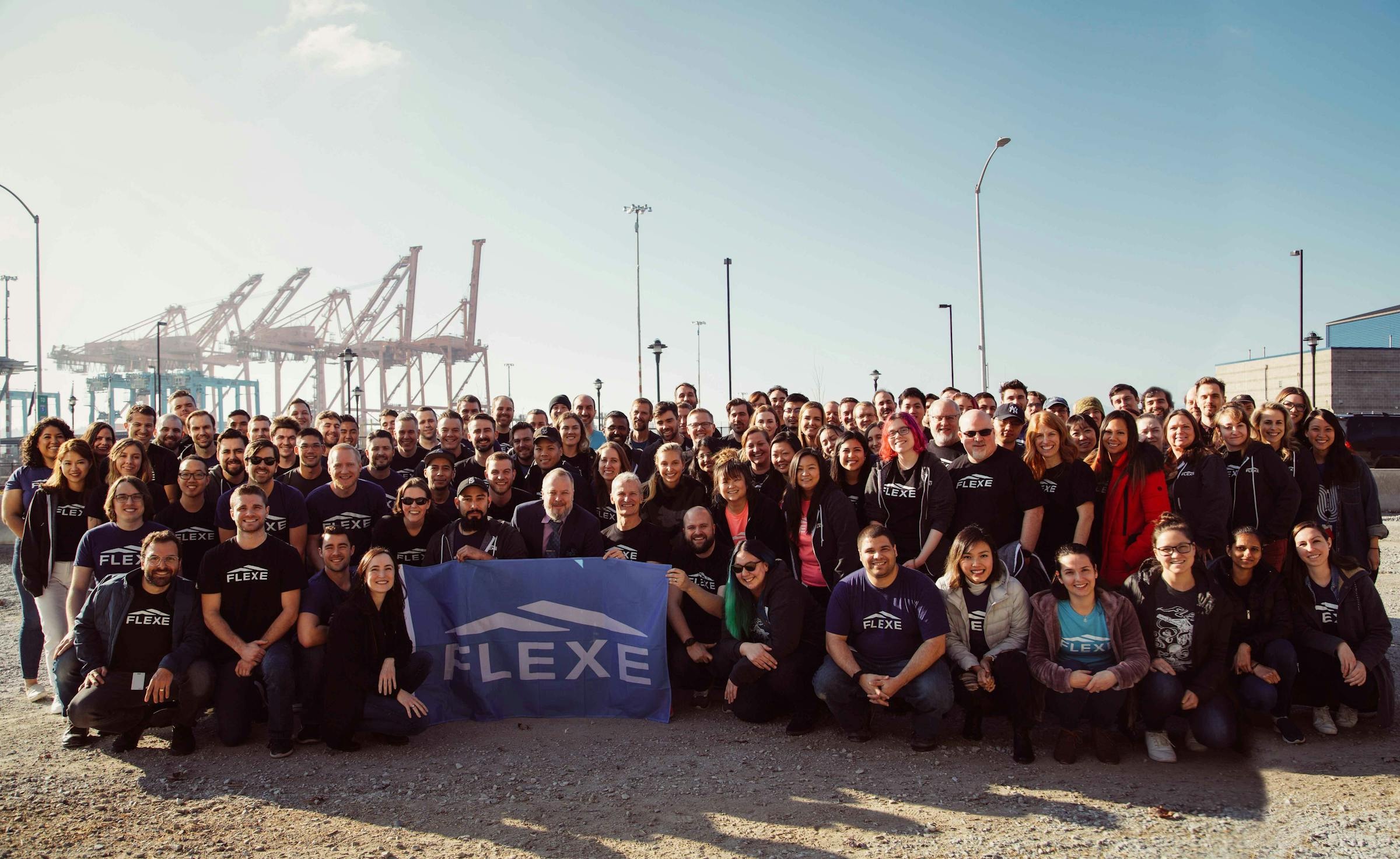 Flexe’s 2019 team gathered outdoors in front of shipping cranes