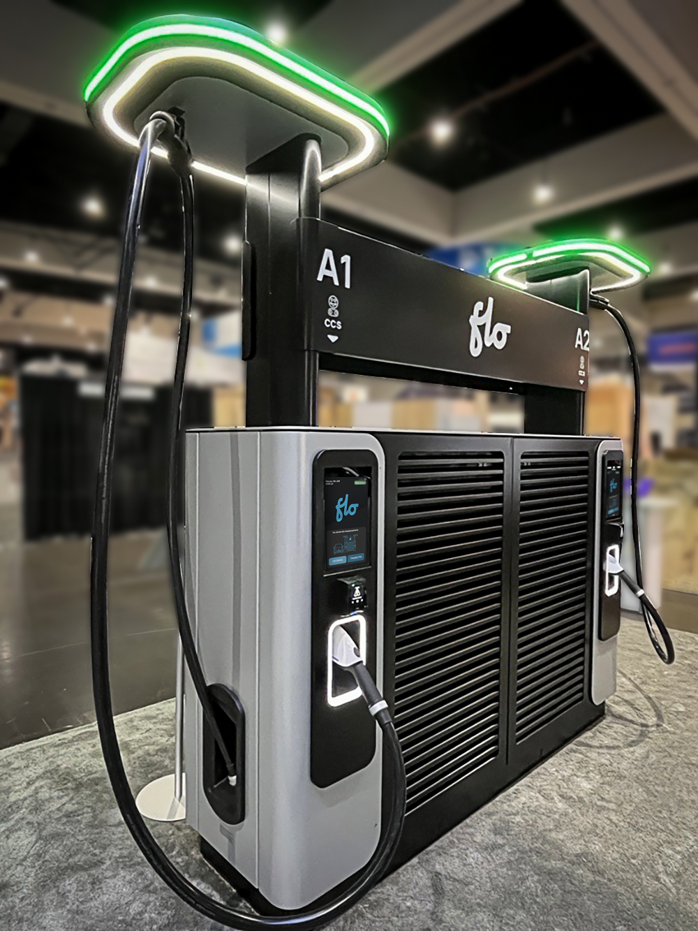 FLO Ultra dual-port fast charger displayed at a trade show