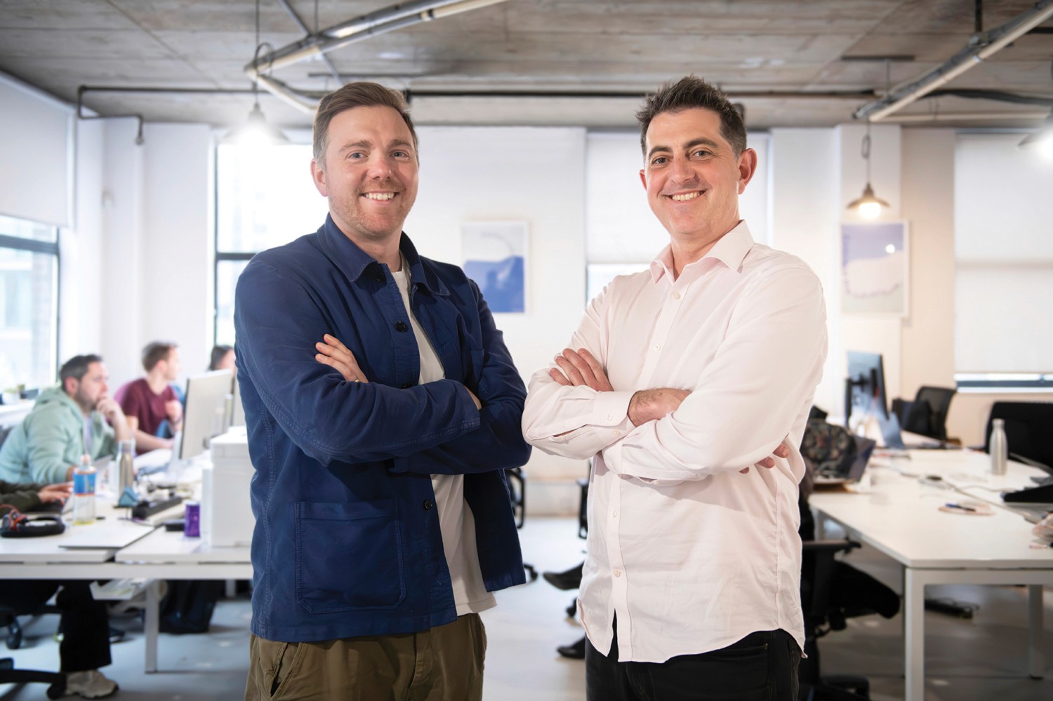 Florence co-founders Charles Armitage and Dan Blake standing in an office