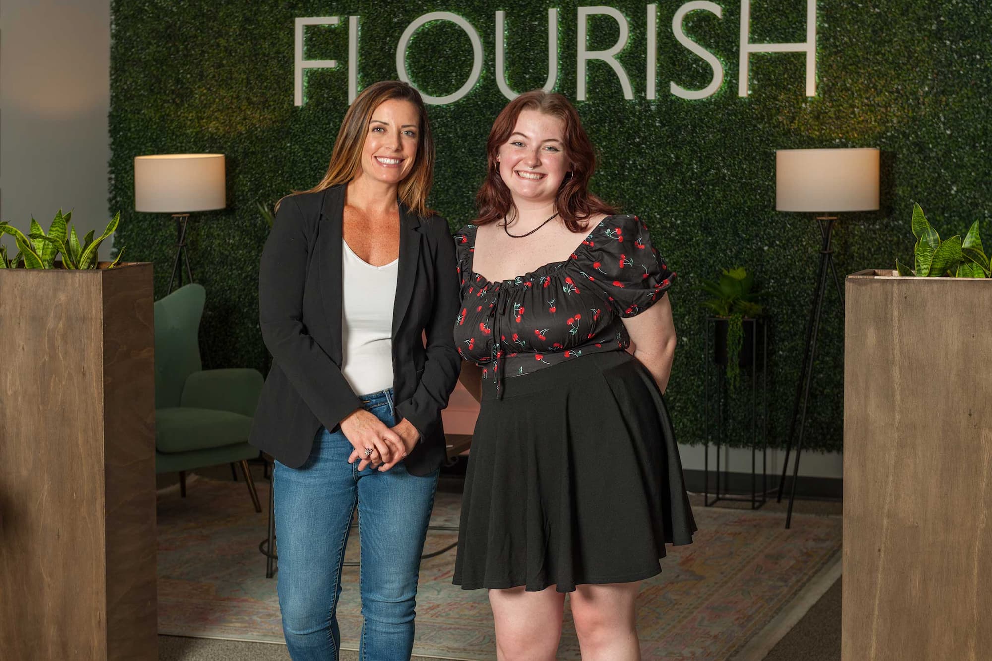 Megan Nivens-Tannett and a Flourish colleague standing in the company's Huntsville office