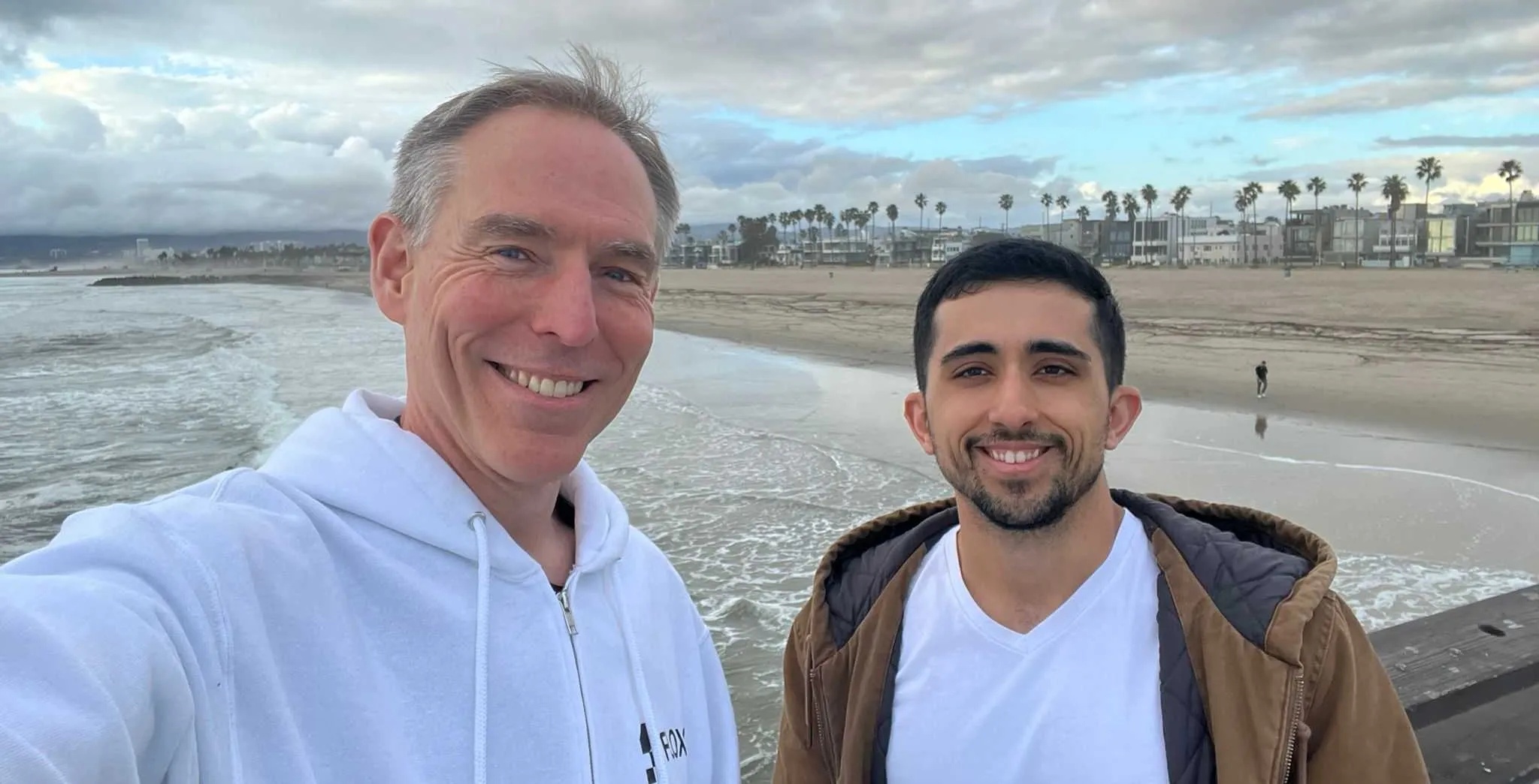 Flox co-founders Michael Brantley and Ron Efroni photographed together at a beach