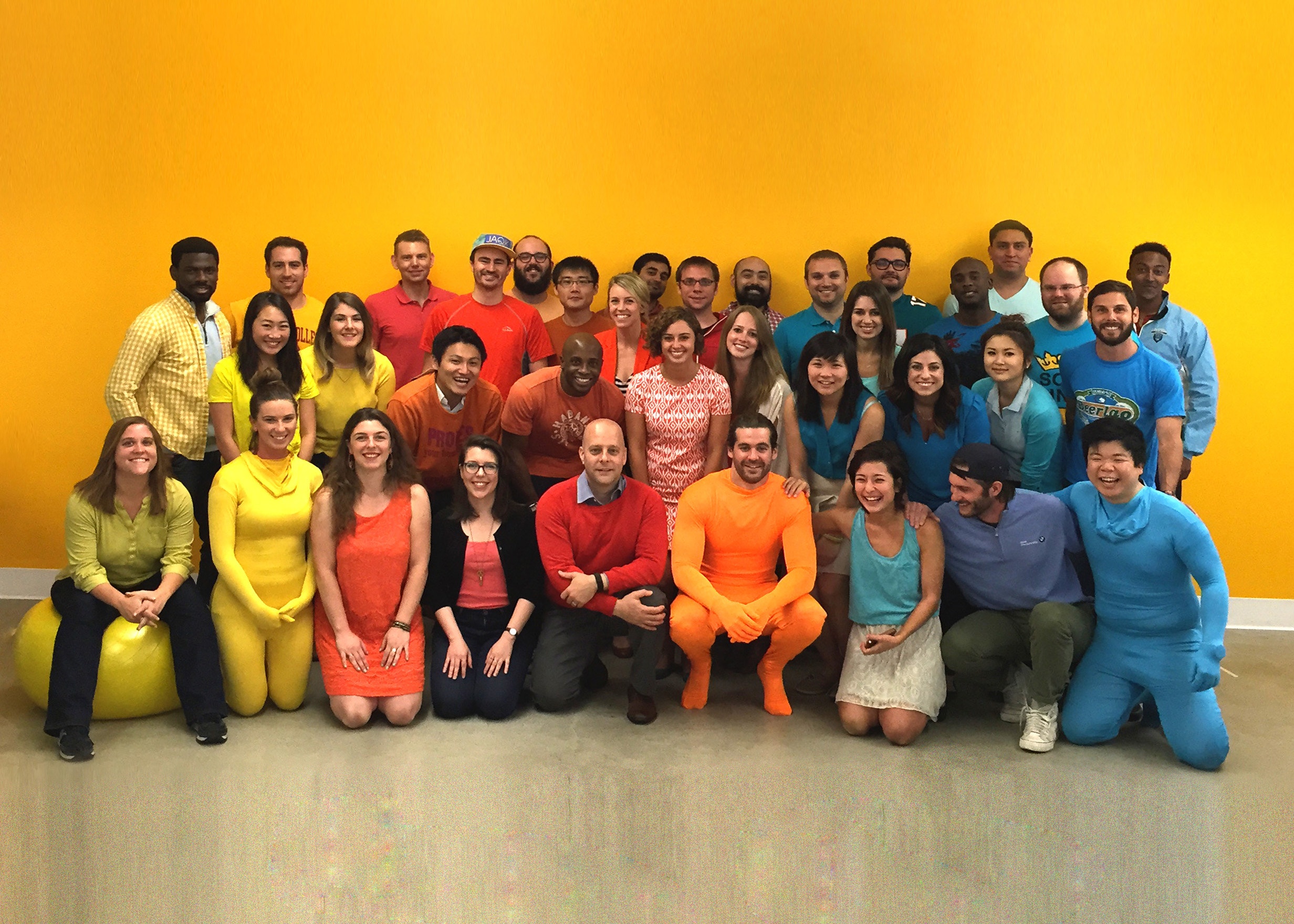 AnyPerk employees gathered in the office in a historical team photograph