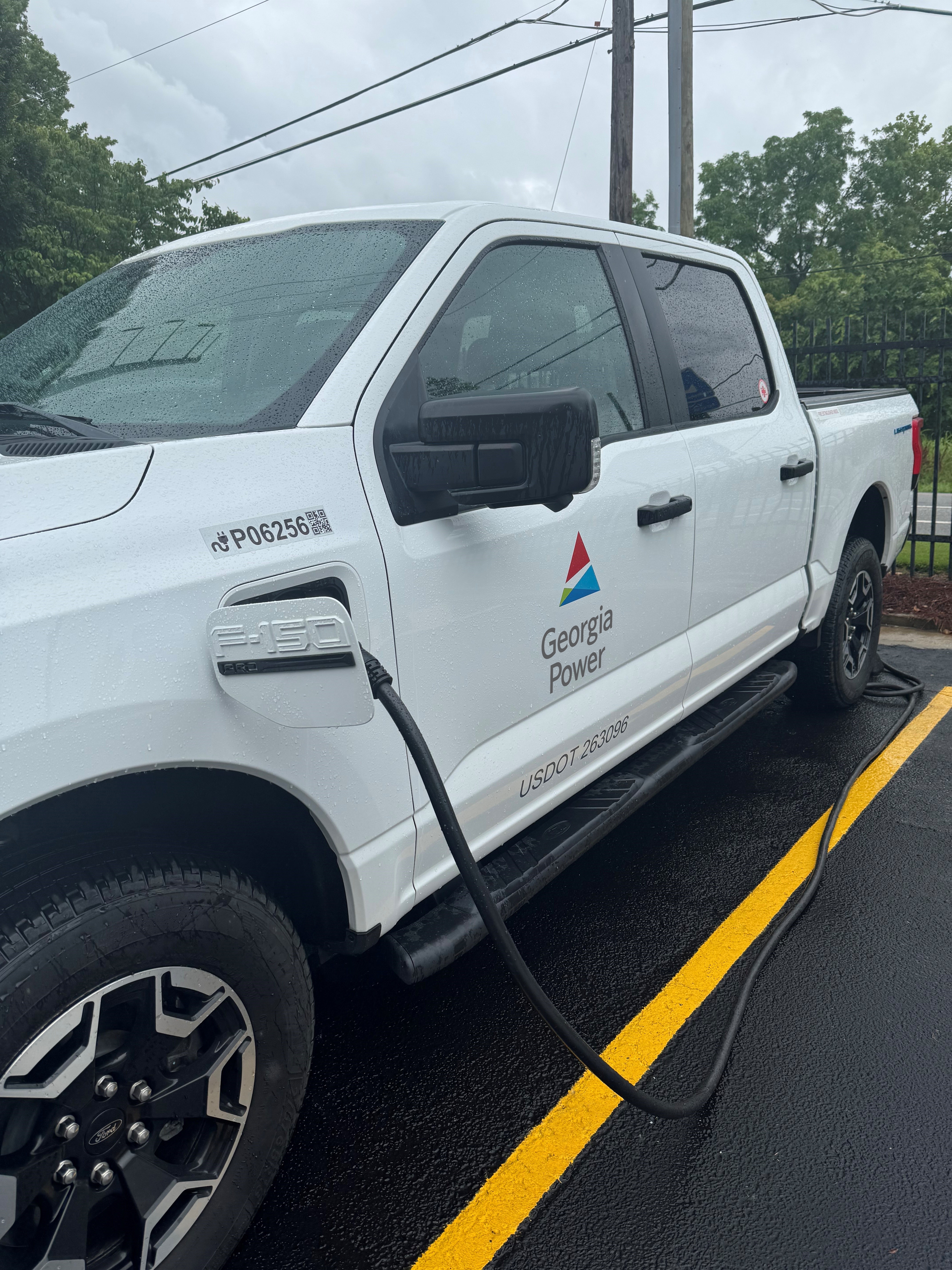 Georgia Power Ford F-150 Lightning connected to a charging cable
