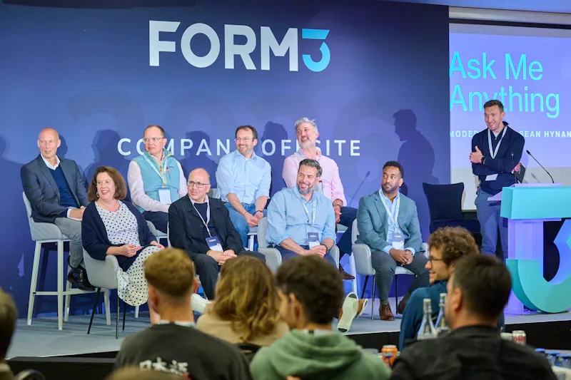 Form3 colleagues gathered on stage for an Ask Me Anything session at a company offsite