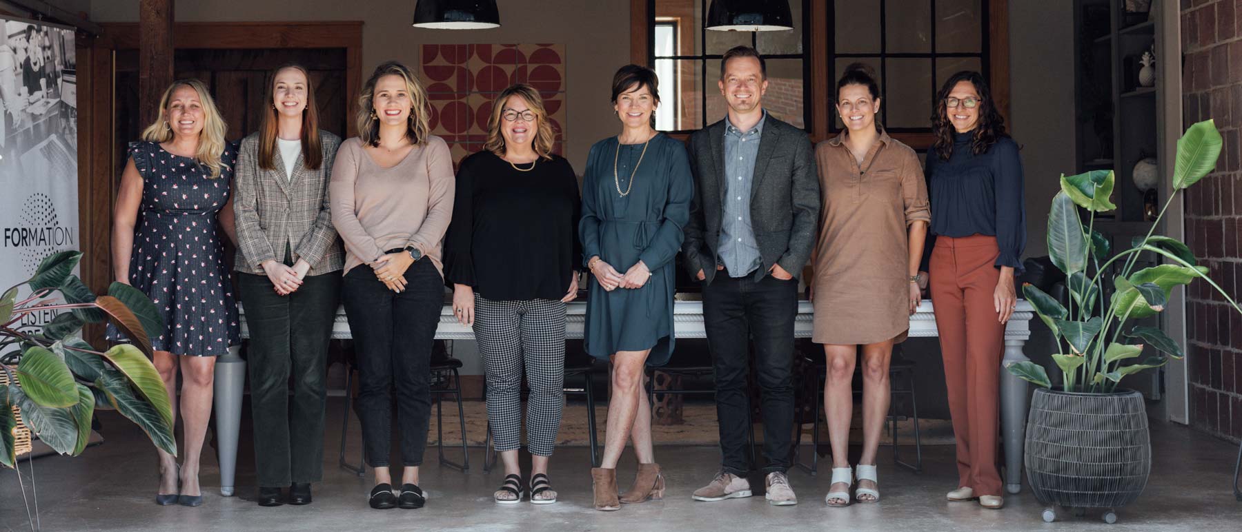 The Formation PR and Brand team standing together inside its Hendersonville office