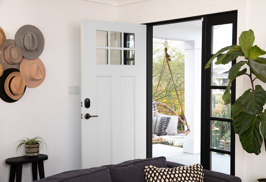A Yale keypad smart lock fitted to a white residential front door
