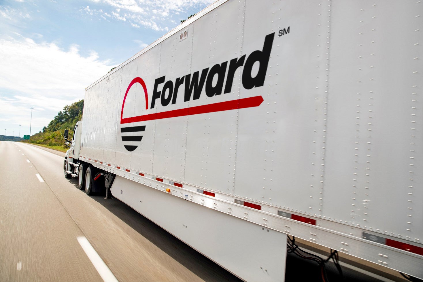 A Forward-branded tractor-trailer traveling on a highway