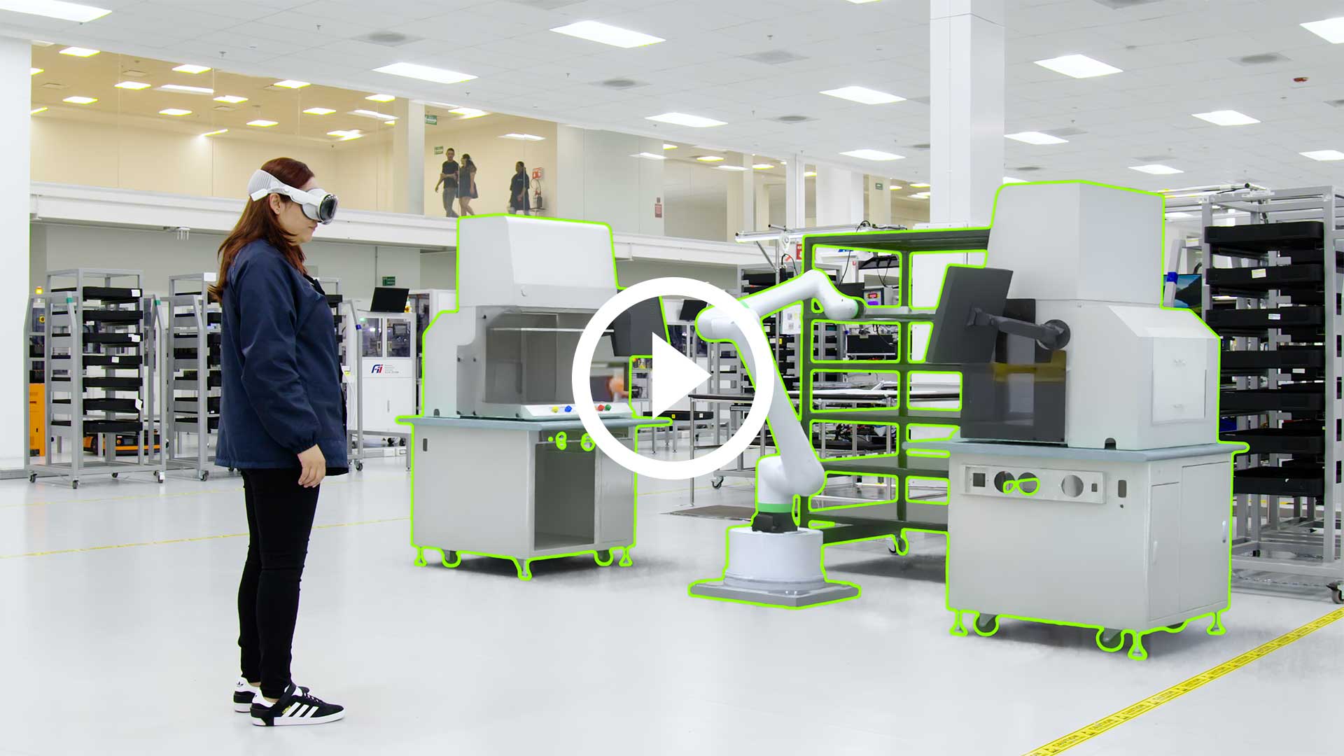 Promotional visualization of a headset user among factory machinery and robotic arms