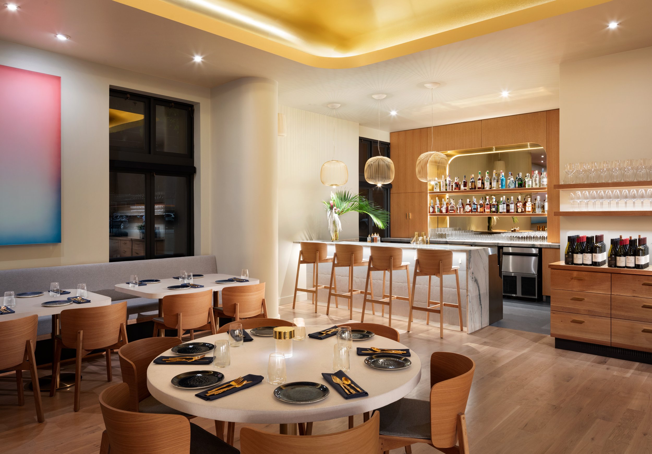 Warm wood dining room inside Kann in Portland