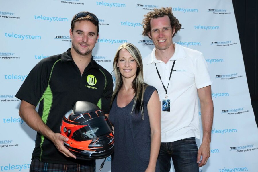 Andrew Ranger holding a racing helmet, Joannie Proulx and François-Charles Sirois at a TRIOOMPH event