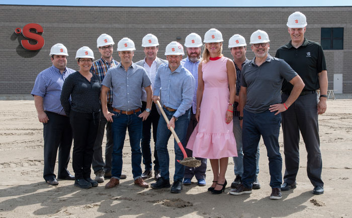 Stelpro leaders in hard hats at the 2018 Saint-Bruno plant groundbreaking