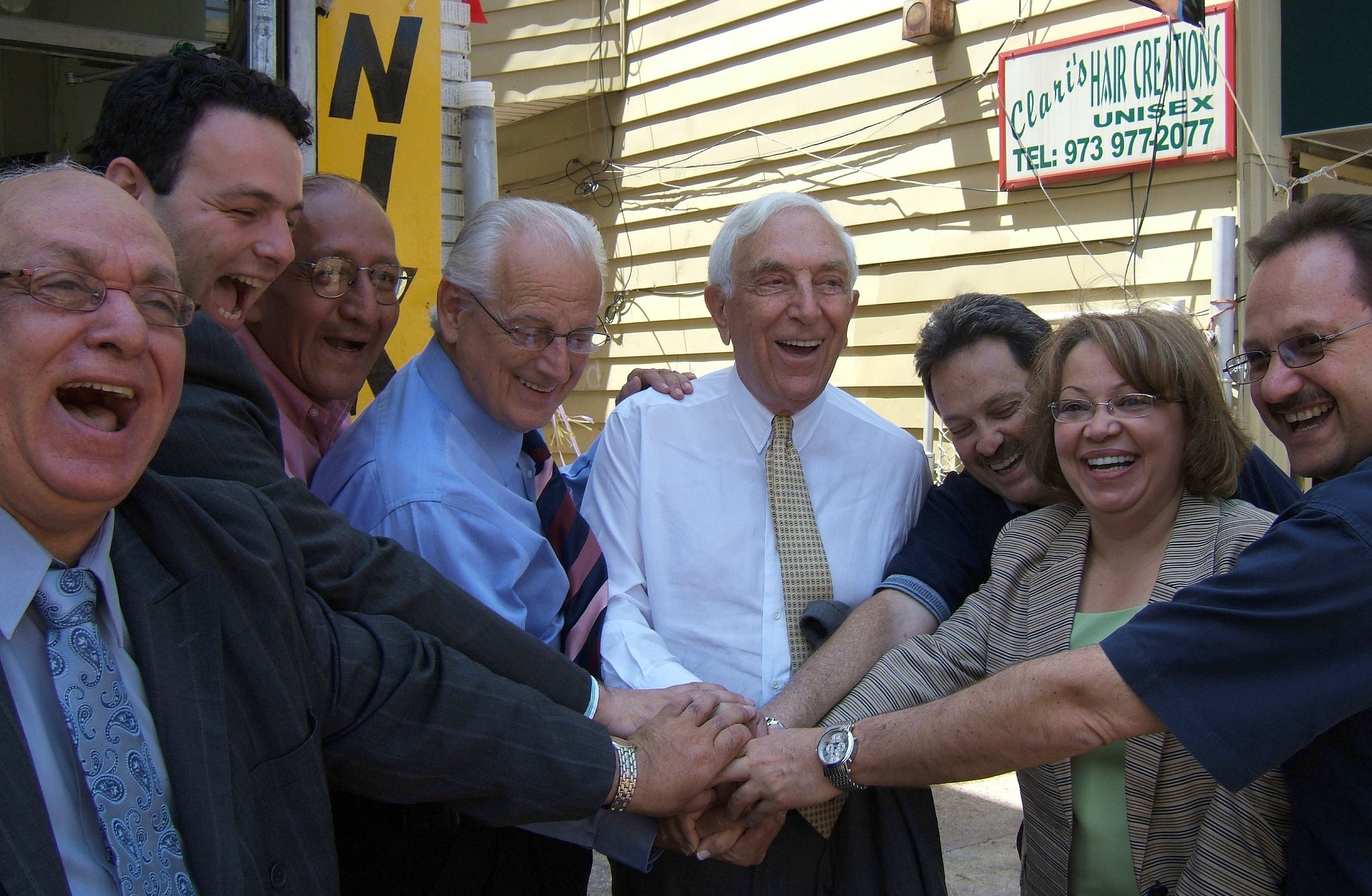 Frank Lautenberg, at center, laughing with Bill Pascrell and a group of campaign supporters in Paterson