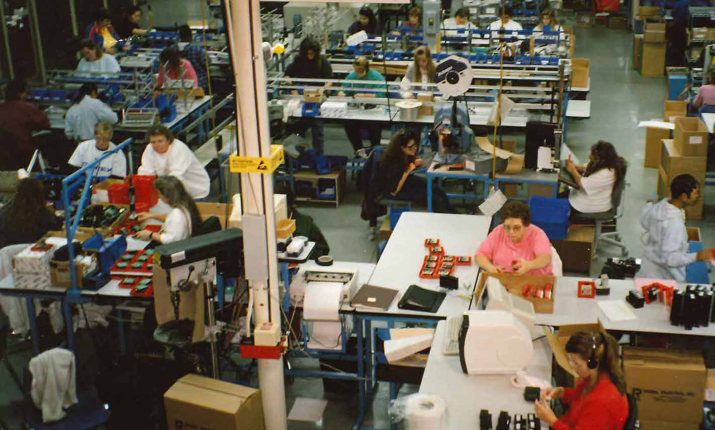 Workers assembling products at Gentex's original Chicago Drive fire protection facility