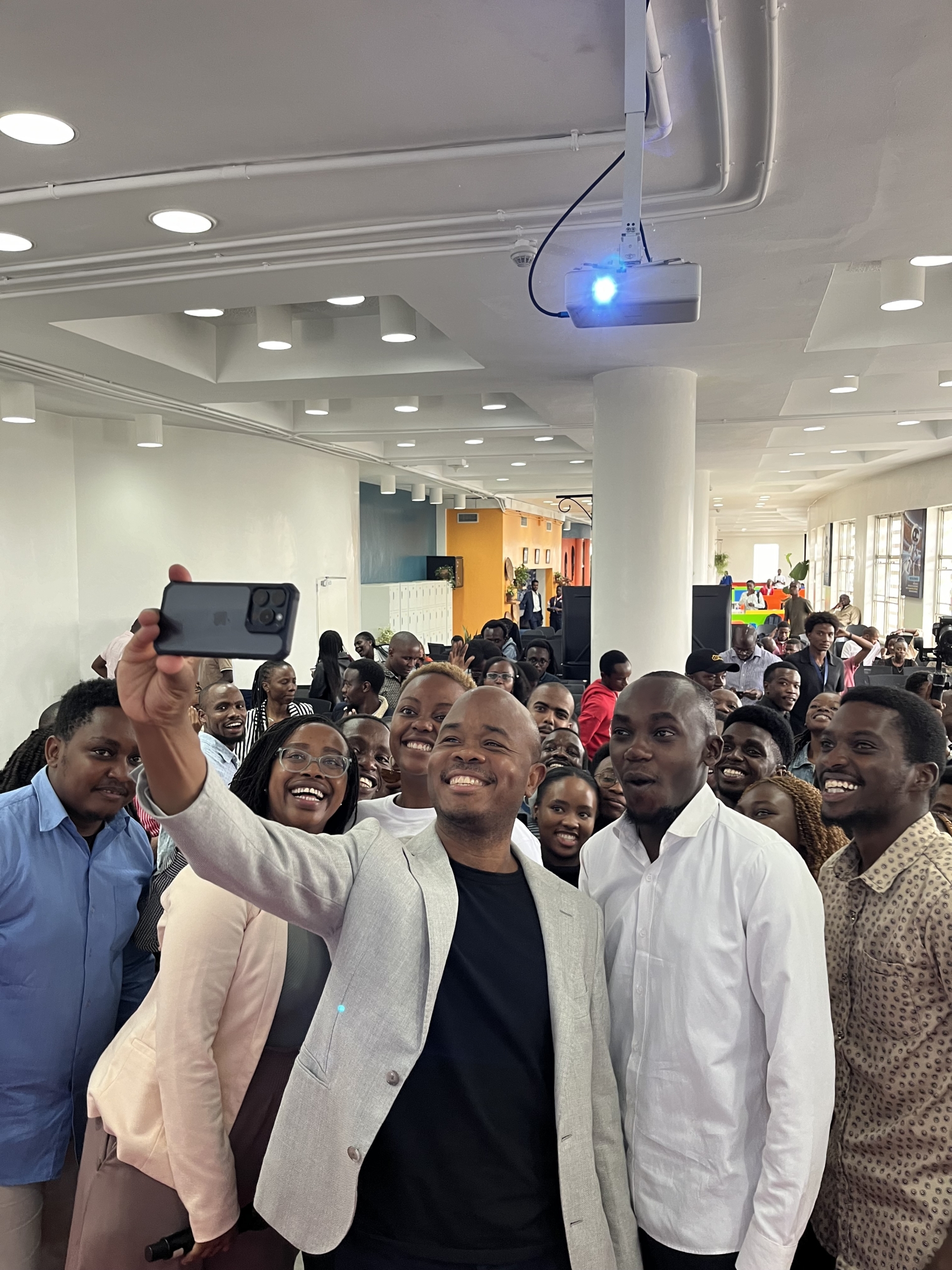 Fred Swaniker standing with a group of ALX learners
