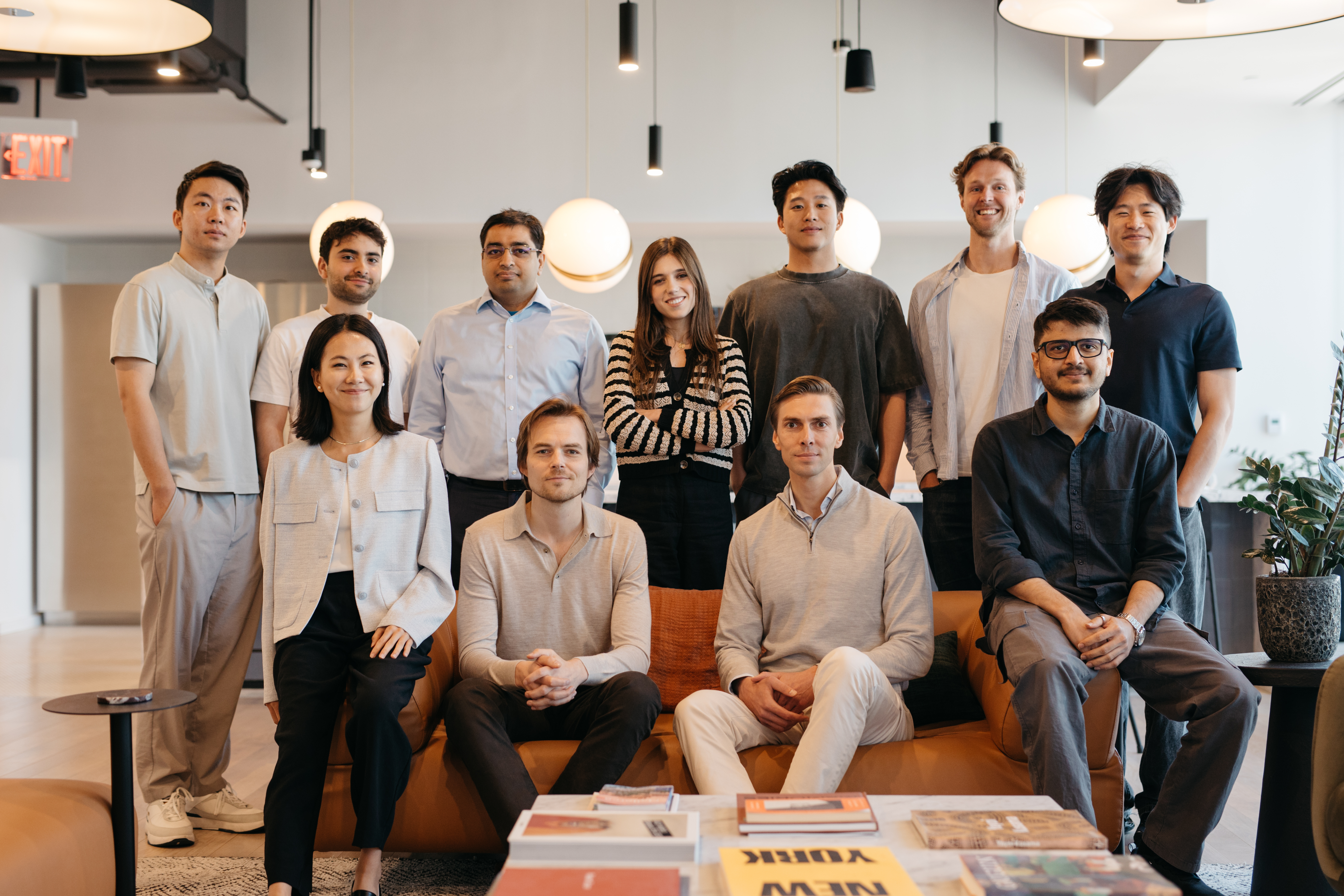 Frederik Kofoed Hansen seated with the DiligenceSquared team in an office