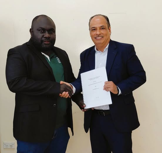 Joshua Tauko and Aldo Sagastume at the Bougainville FreeBalance contract signing