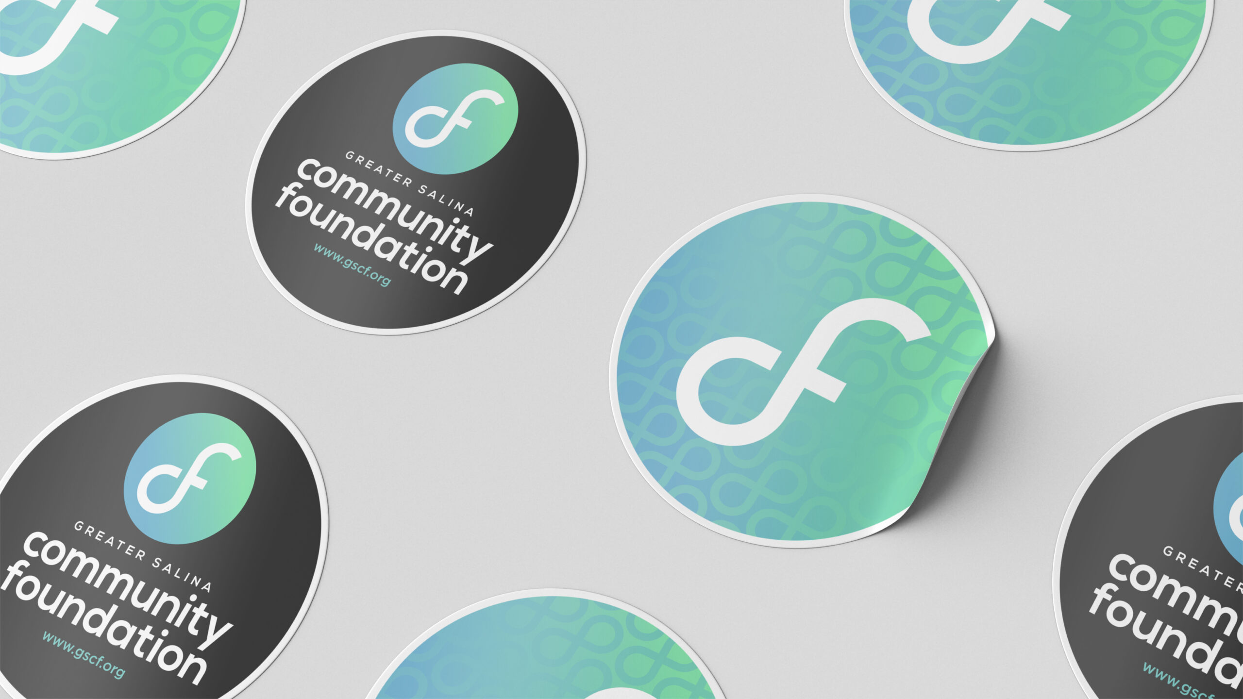 Greater Salina Community Foundation branding shown on circular sticker mockups