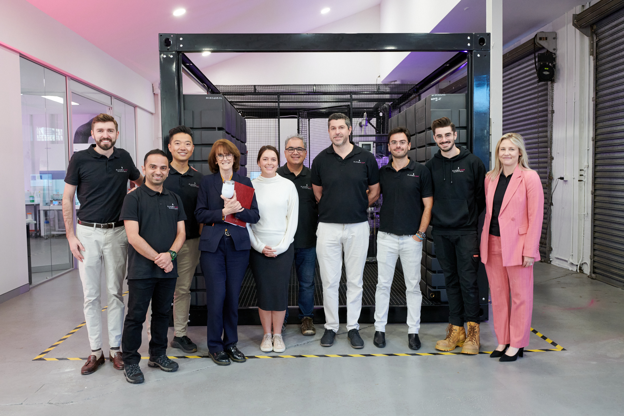 Frere Byrne, at far left, with Cathy Foley and PlasmaLeap colleagues at the 2023 laboratory visit