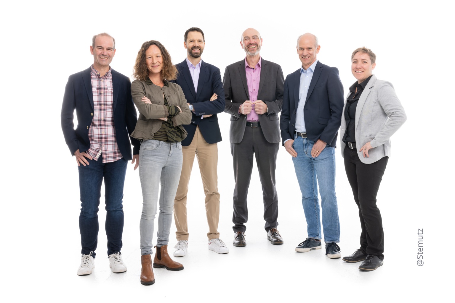 Six members of the Fri Up team standing together in a studio portrait