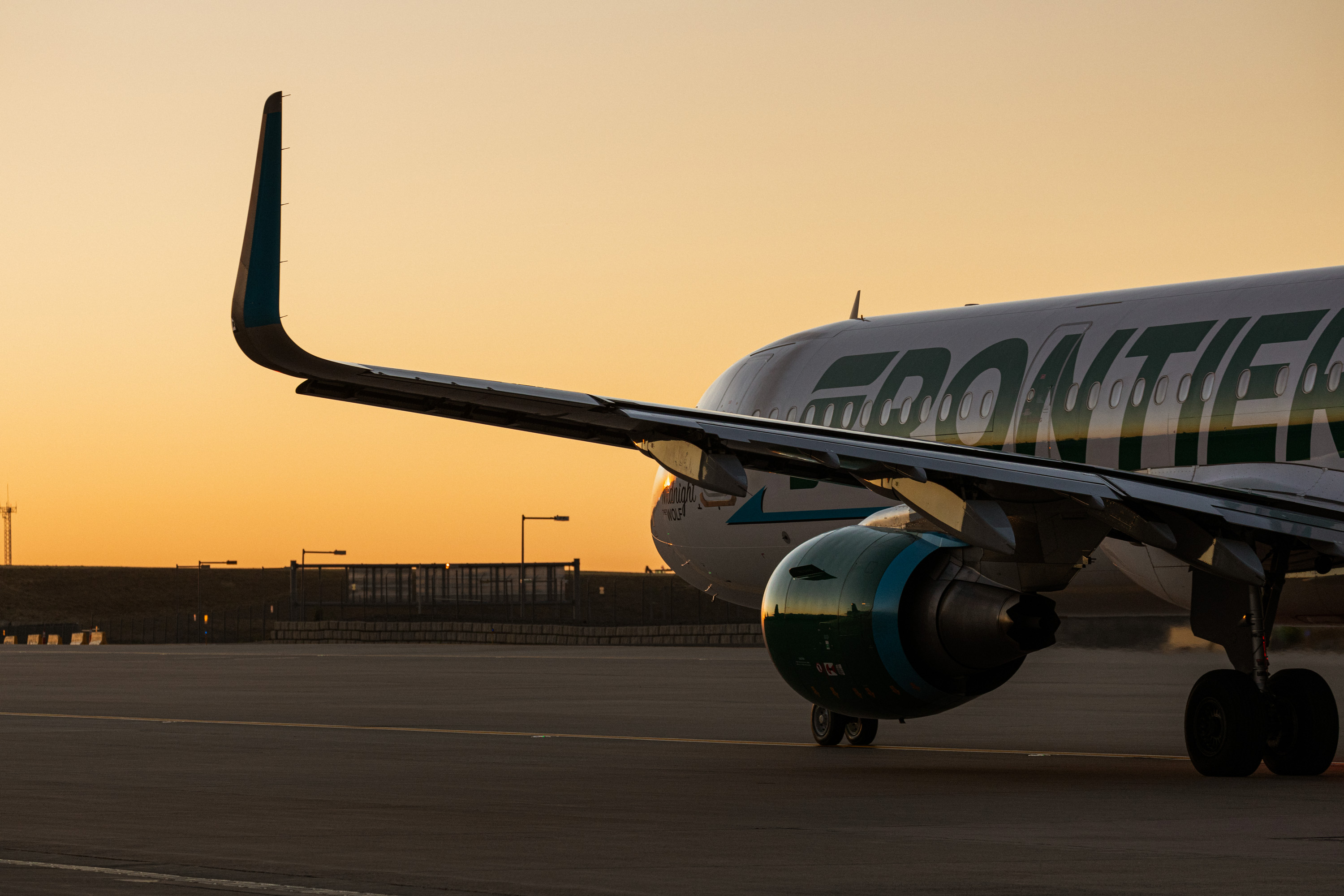 A Frontier Airbus on the ramp in warm evening light