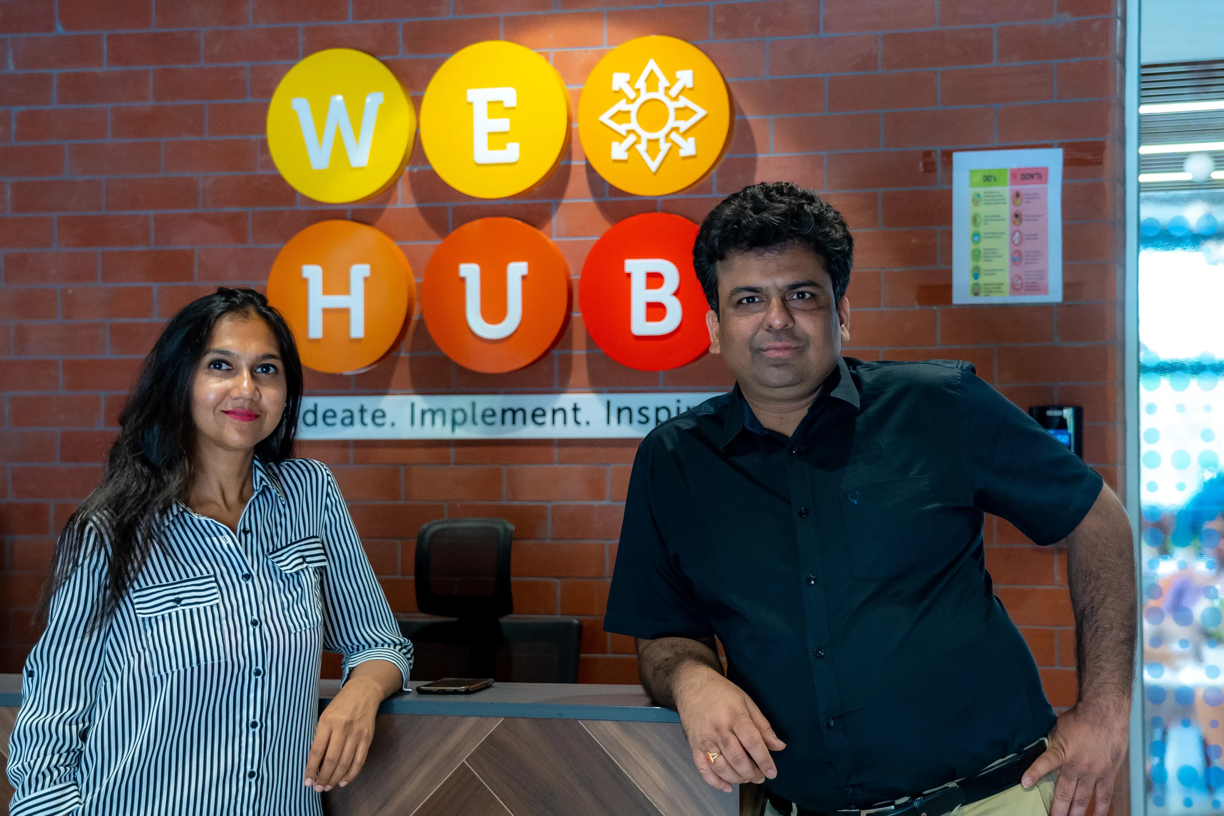 Frugal Testing founders Bharti Garg and Rupesh Garg standing at WE HUB