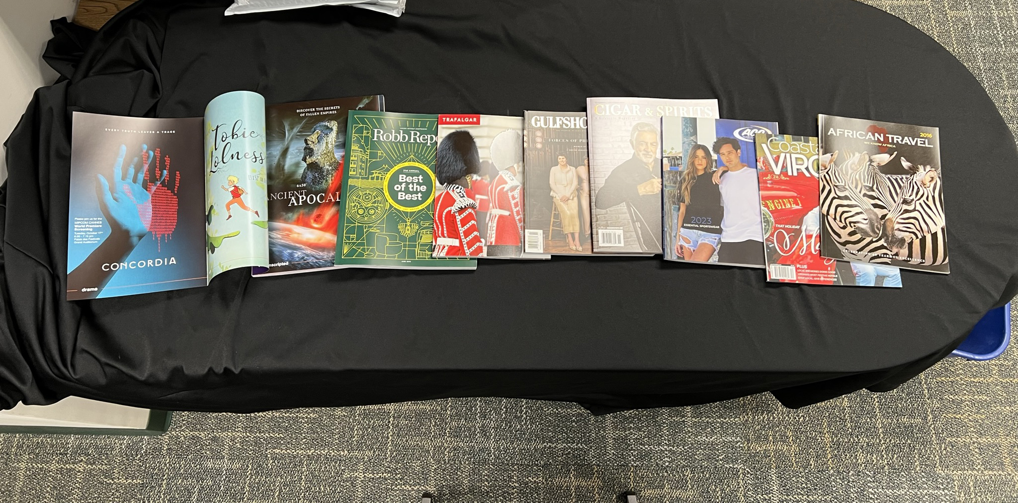 An assortment of magazines and catalogs displayed by Fry, including travel and lifestyle publications