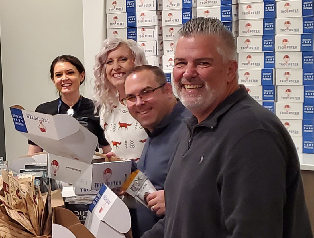 FTI Defense employees packing Troopster care packages for deployed service members