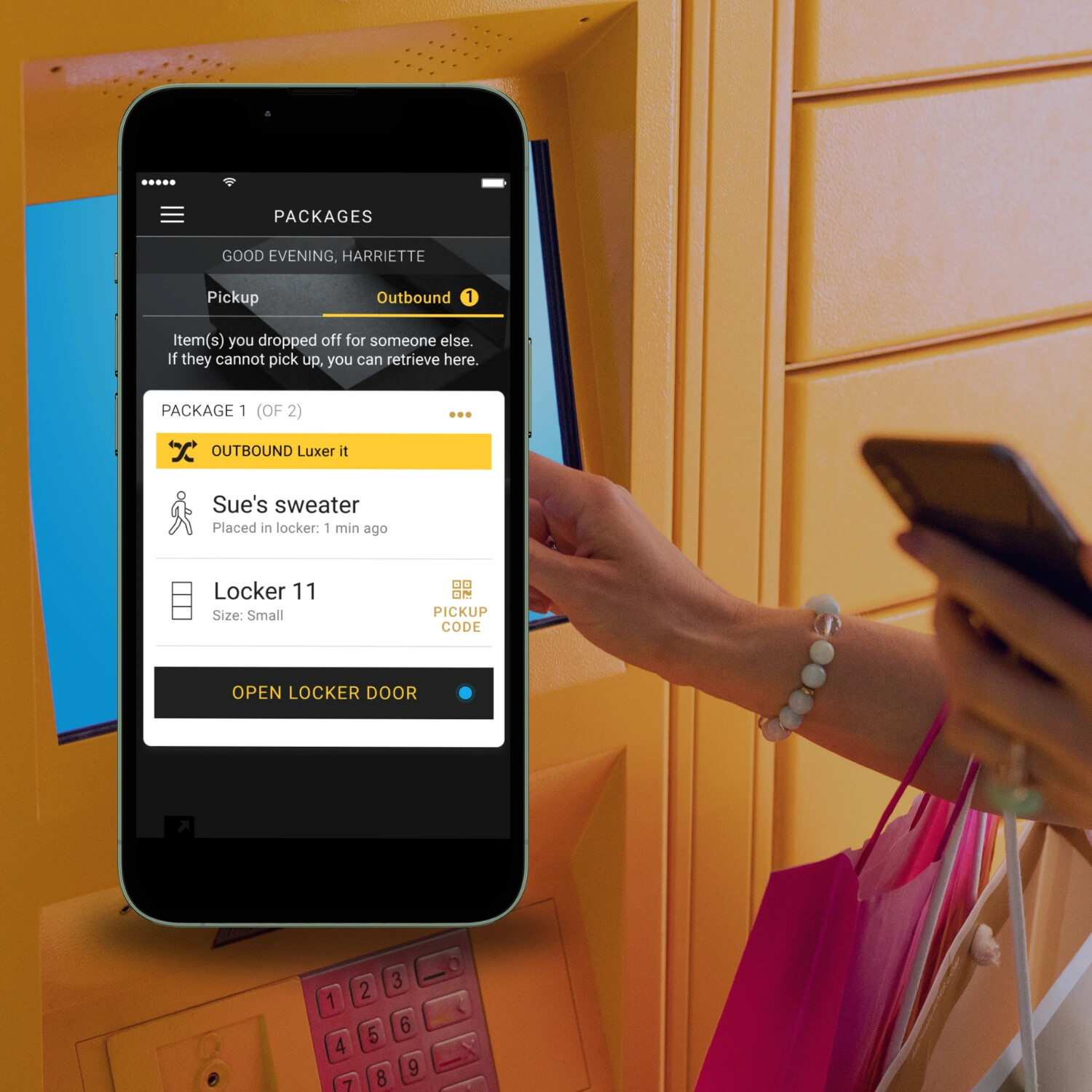 A Luxer One parcel locker with a mobile application interface shown in front