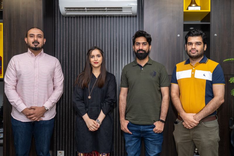 Furqan Aziz, third from left, standing with visitors at InvoZone
