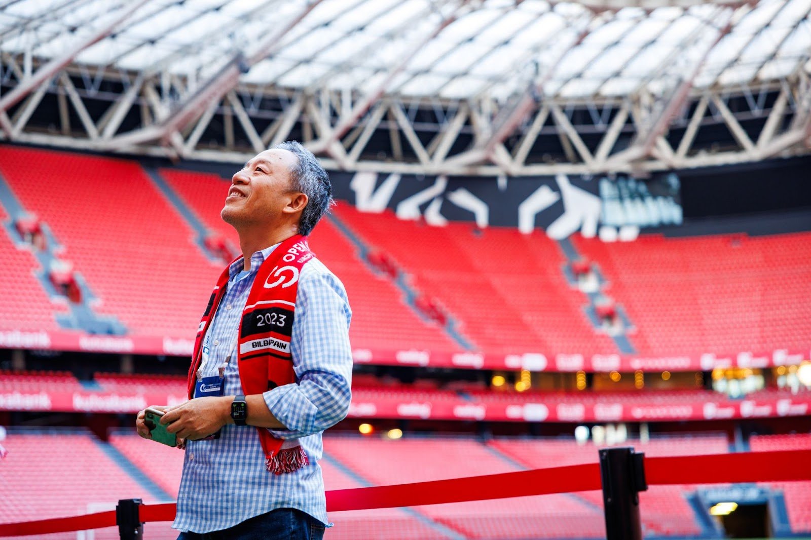 Futurewei’s Wenjing Chu wearing an Open Source Summit scarf at San Mamés stadium in Bilbao