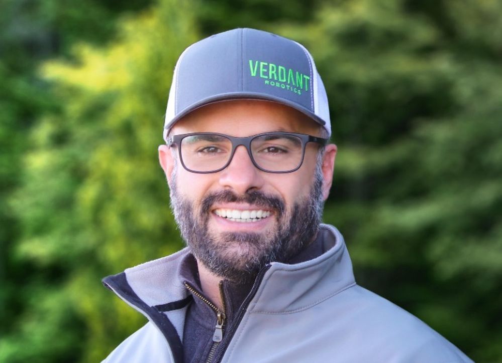 Gabe Sibley outdoors wearing glasses and a Verdant Robotics cap