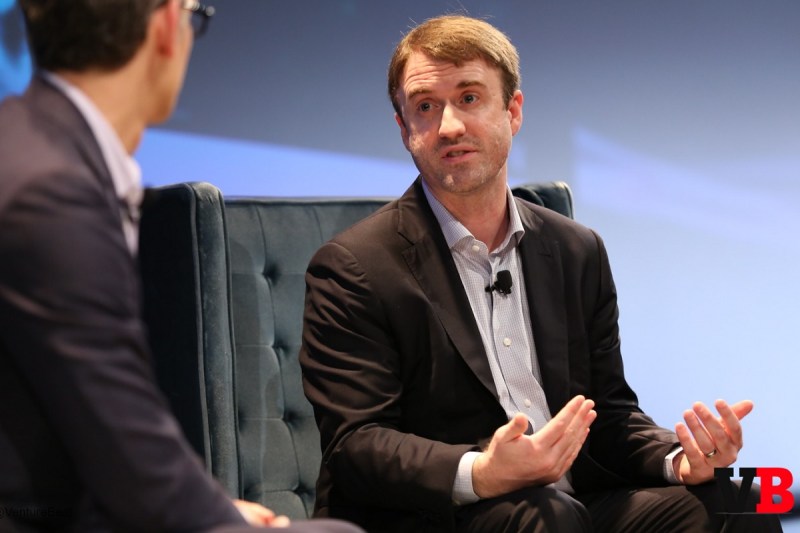 Gabriel Leydon speaking with an interviewer onstage at MobileBeat 2016