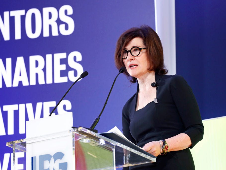 Gail Heimann speaking from an IPG lectern, holding her notes