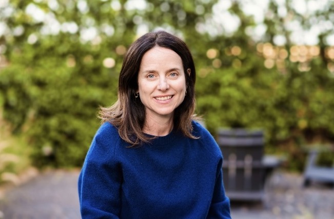 Galia Rosen Schwarz wearing a blue sweater outdoors