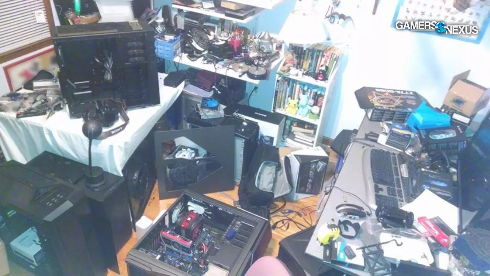 The cluttered bedroom workspace where GamersNexus began