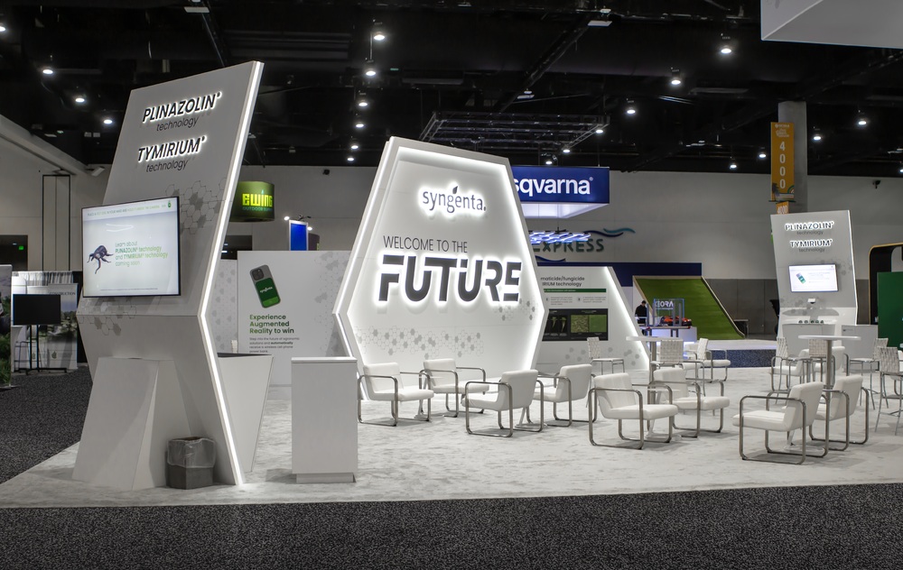 Syngenta’s white Welcome to the Future exhibition booth, with product education screens and seating