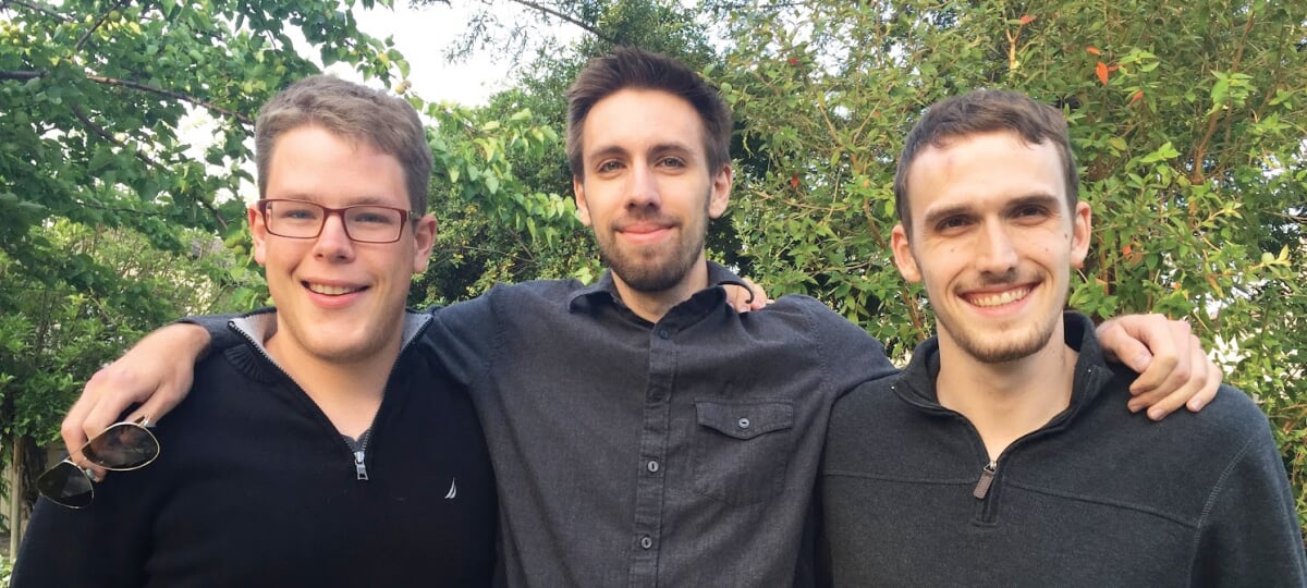 Handshake co-founders Garrett Lord, Scott Ringwelski and Ben Christensen standing together outdoors