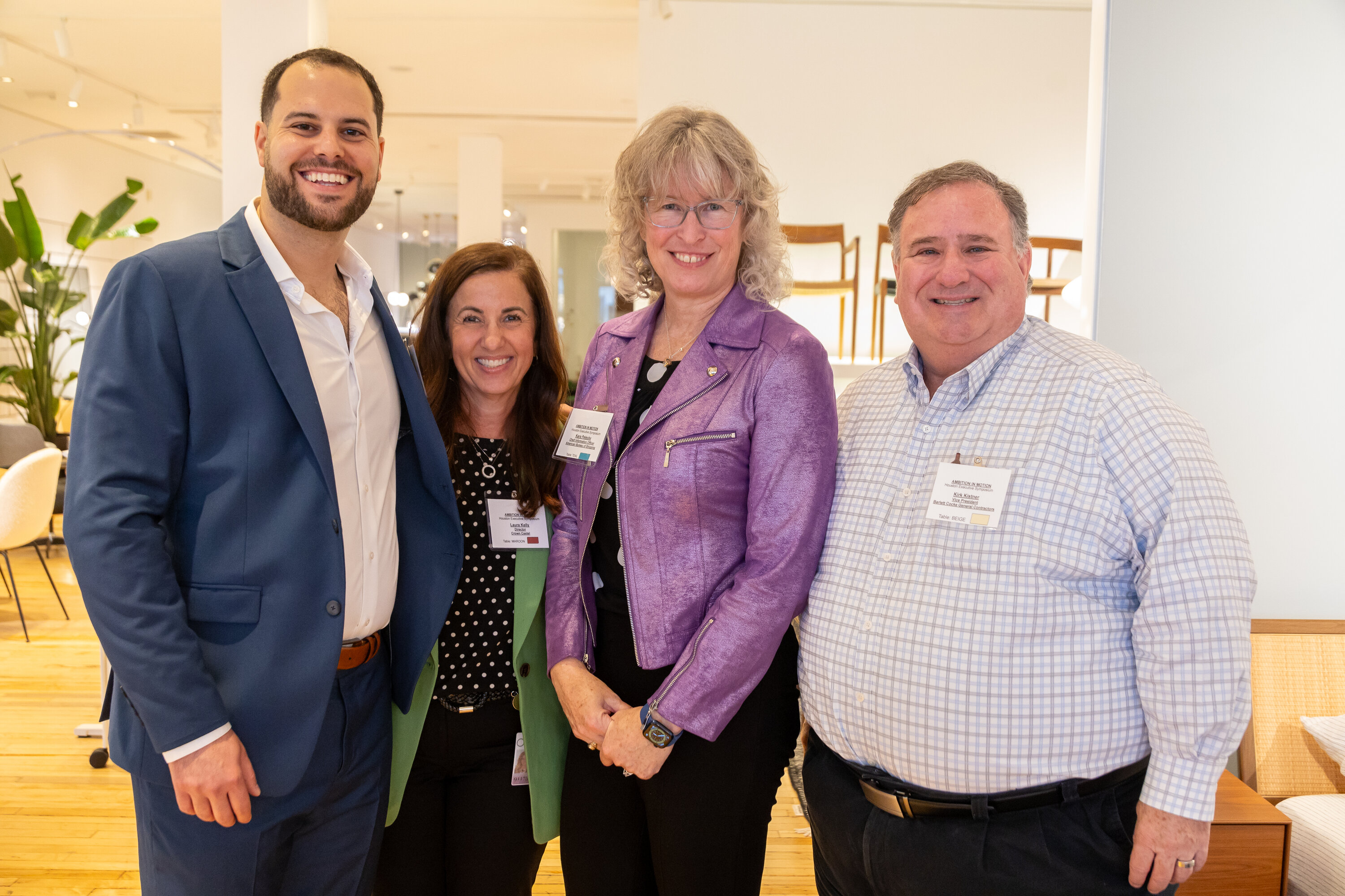 Garrett Mintz with Laura Kelly, Kara Pelecky and Kirk Kistner at Ambition In Motion’s Houston executive symposium.