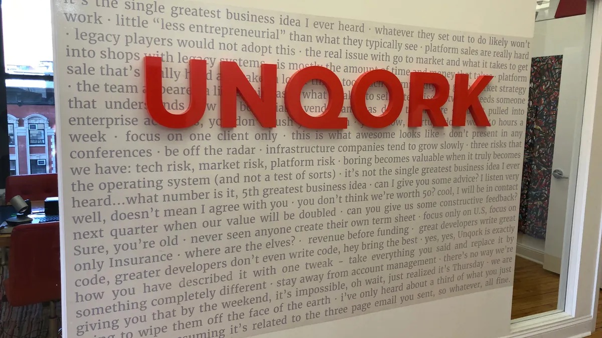 The feedback wall inside Unqork’s New York office