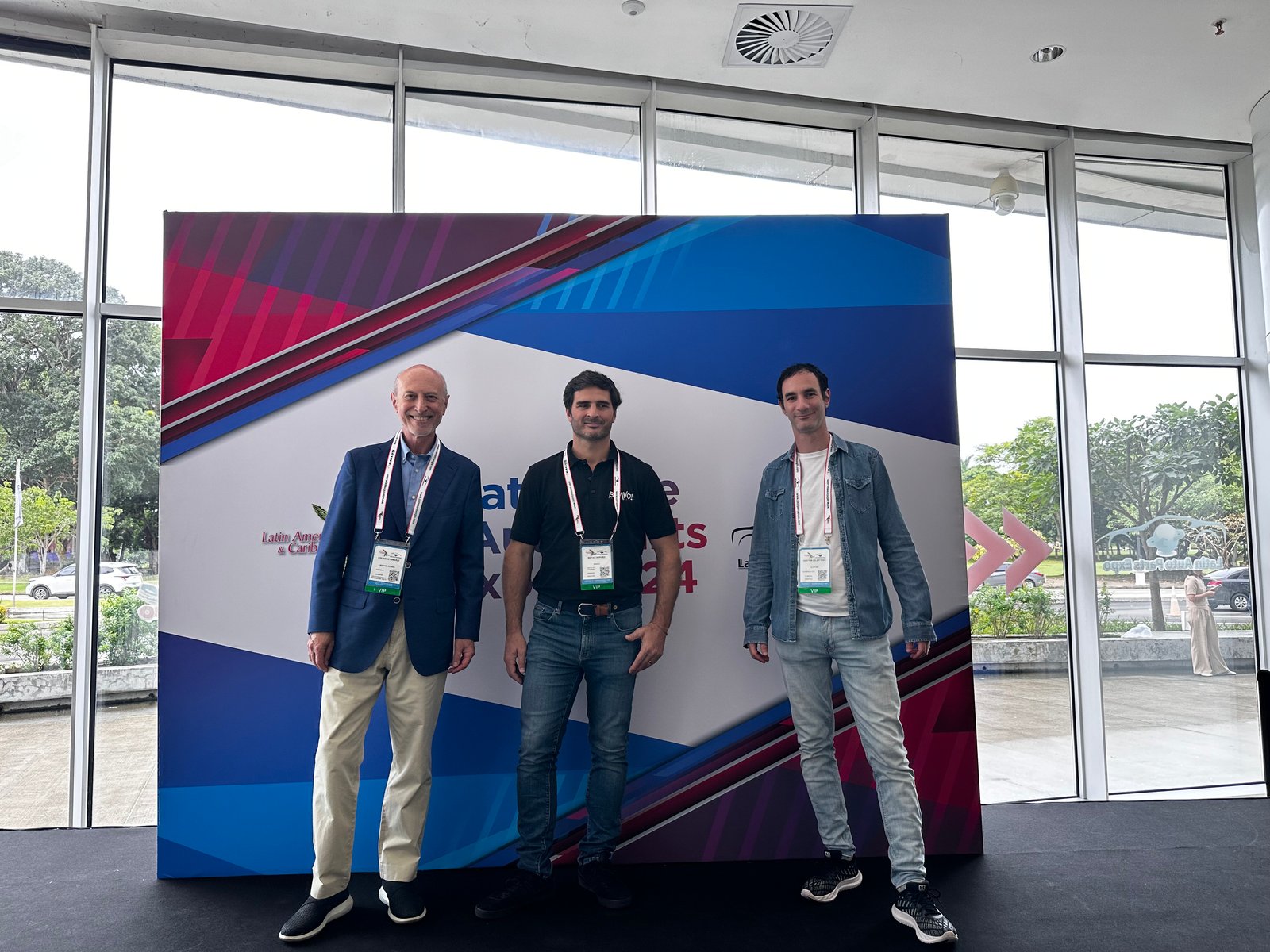 Gaston Zelerteins, at right, with two attendees at the 2024 Latin Tyre and Auto Parts Expo in Panama City