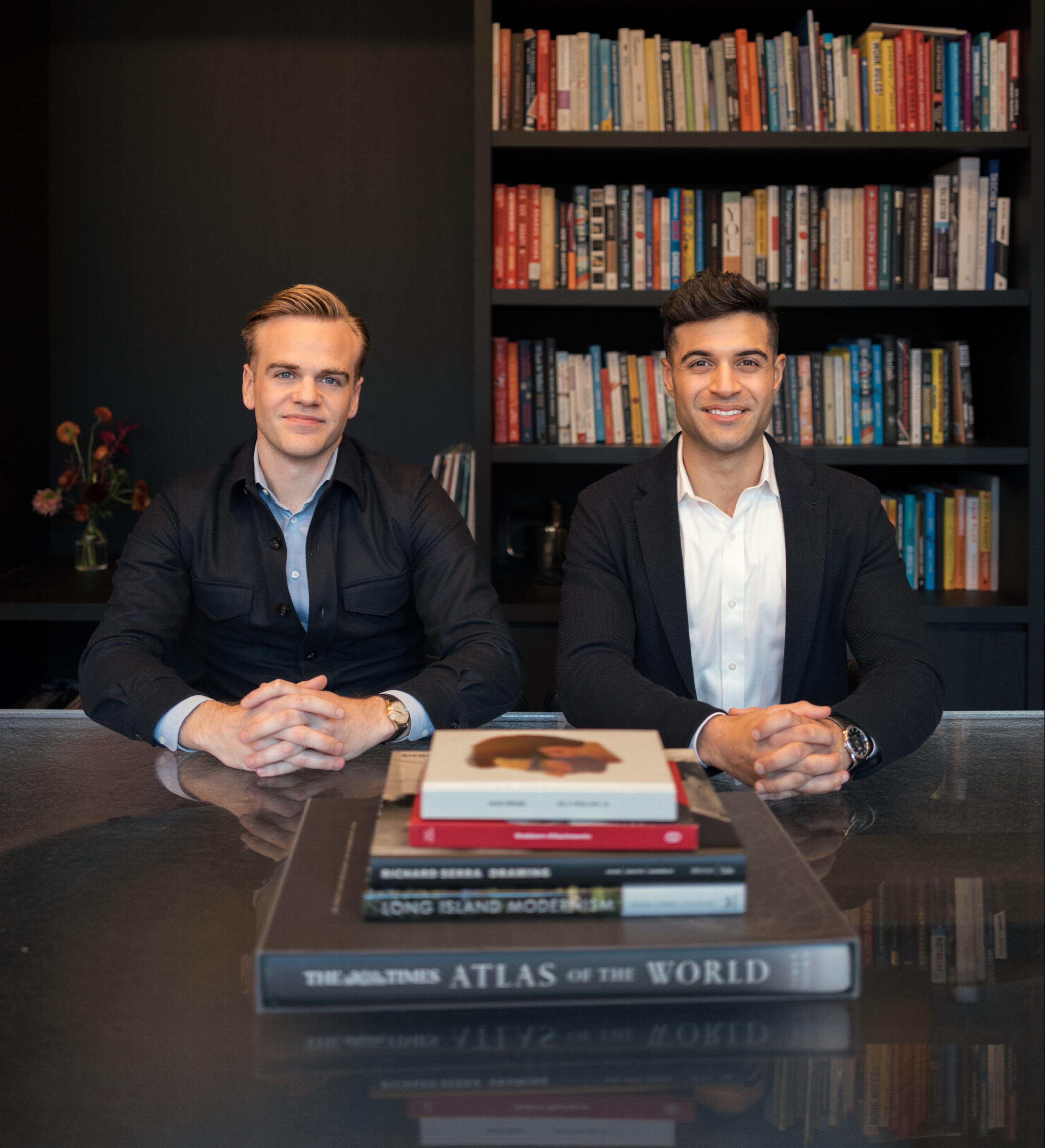 Daragh Murphy, left, and Gaurav Ahuja, right, seated together in front of bookshelves