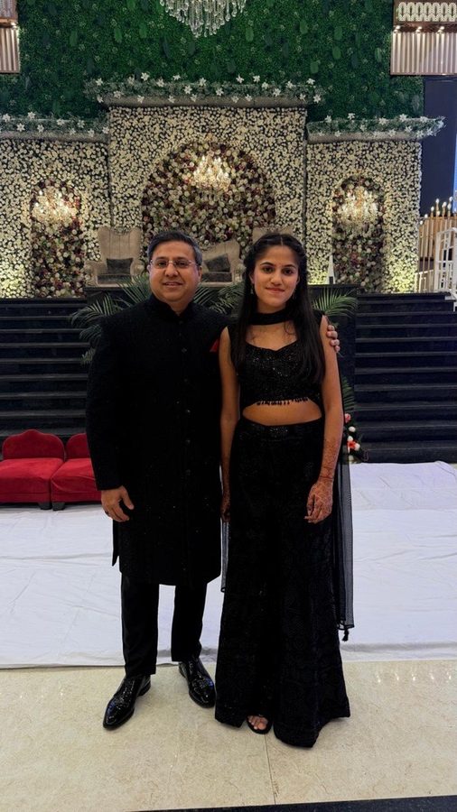Gaurav Kumar standing with his daughter at a family occasion