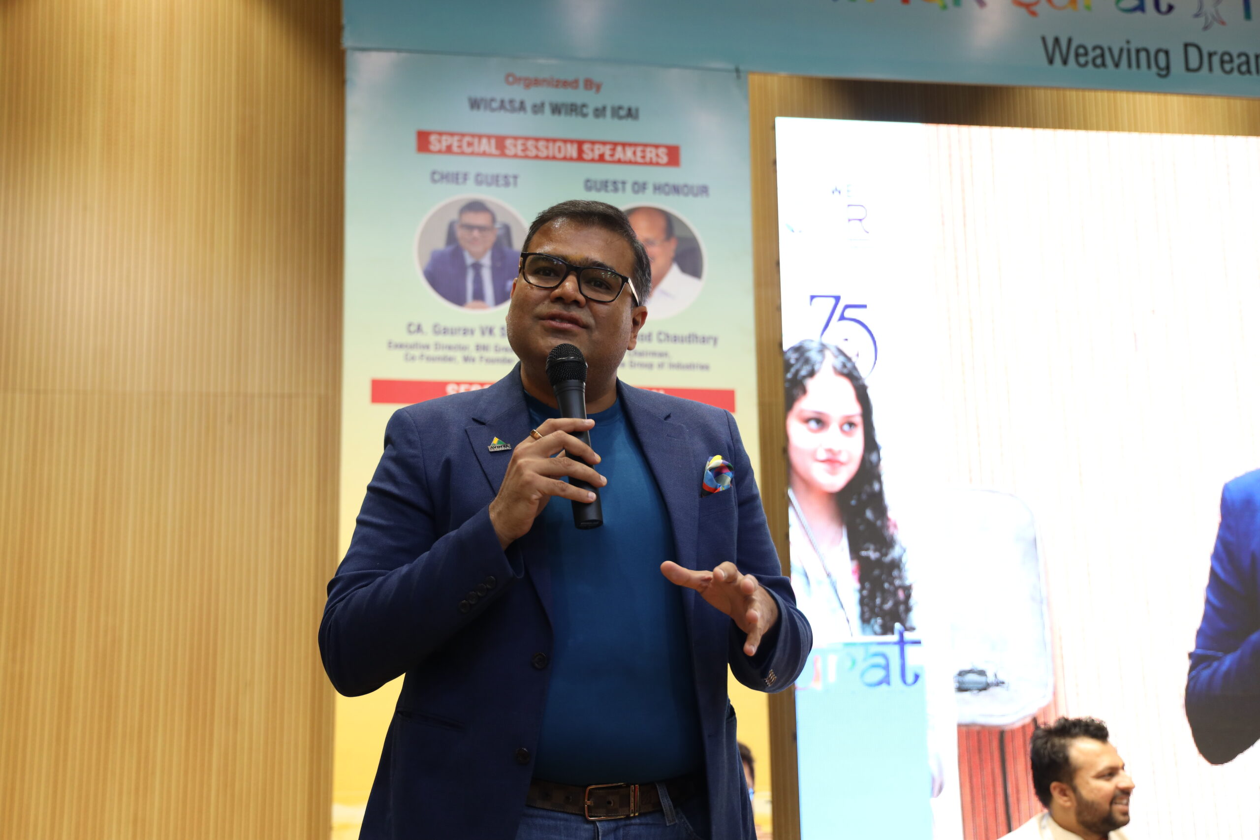 Gaurav VK Singhvi speaking into a microphone at an ICAI event