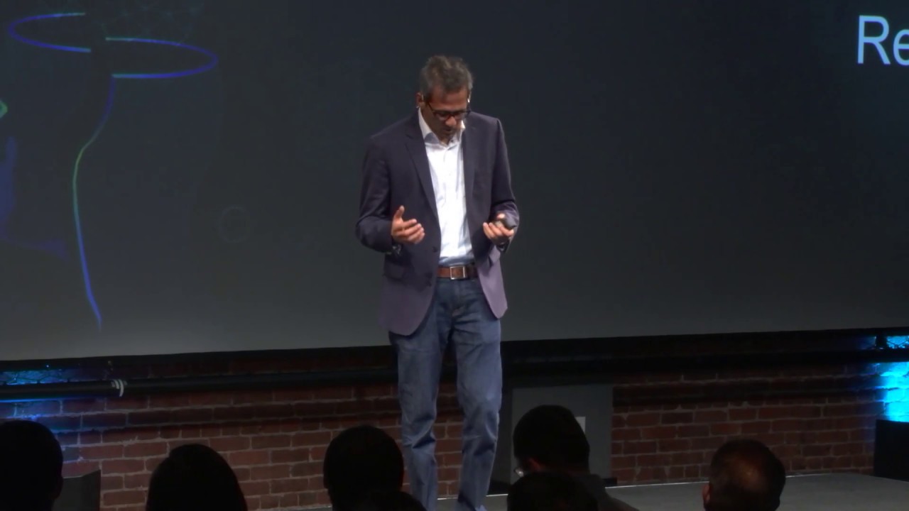 Gautham Viswanathan presenting Workato product updates onstage